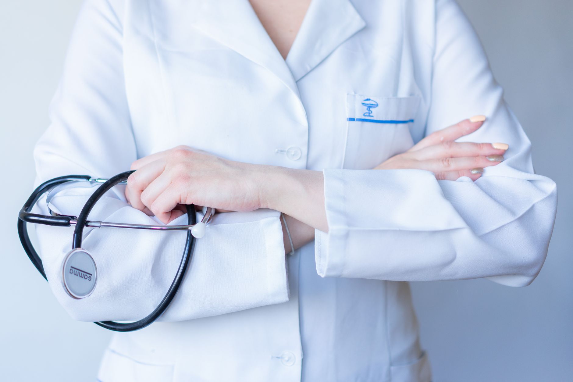 A close-up image of a doctor in a white coat with a stethoscope and arms crossed. — 9 Humorous Jack Sparrow Costs - Pirates o