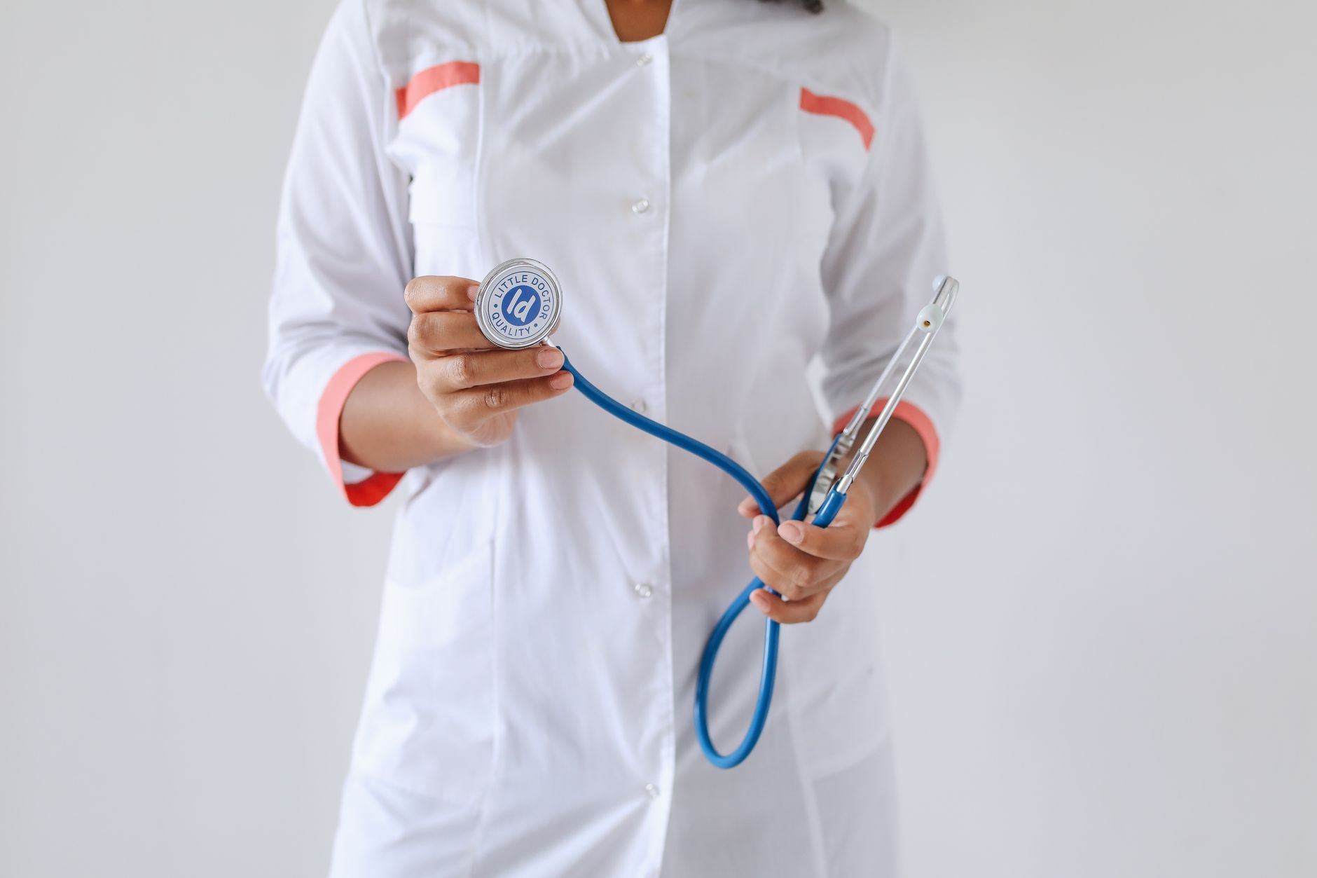 Close-up of a female doctor holding a blue stethoscope, emphasizing healthcare and professionalism. — Buying the Correct Medi