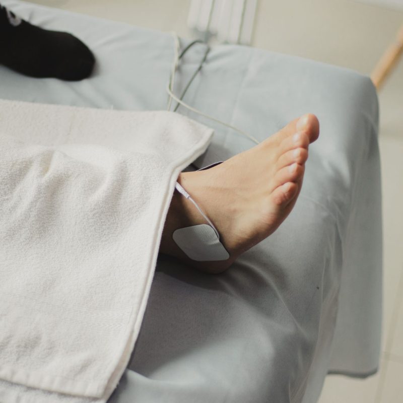 A close-up image of a bare foot with a medical electrode, suggesting a healthcare setting. — Medisuggestion - The Environment