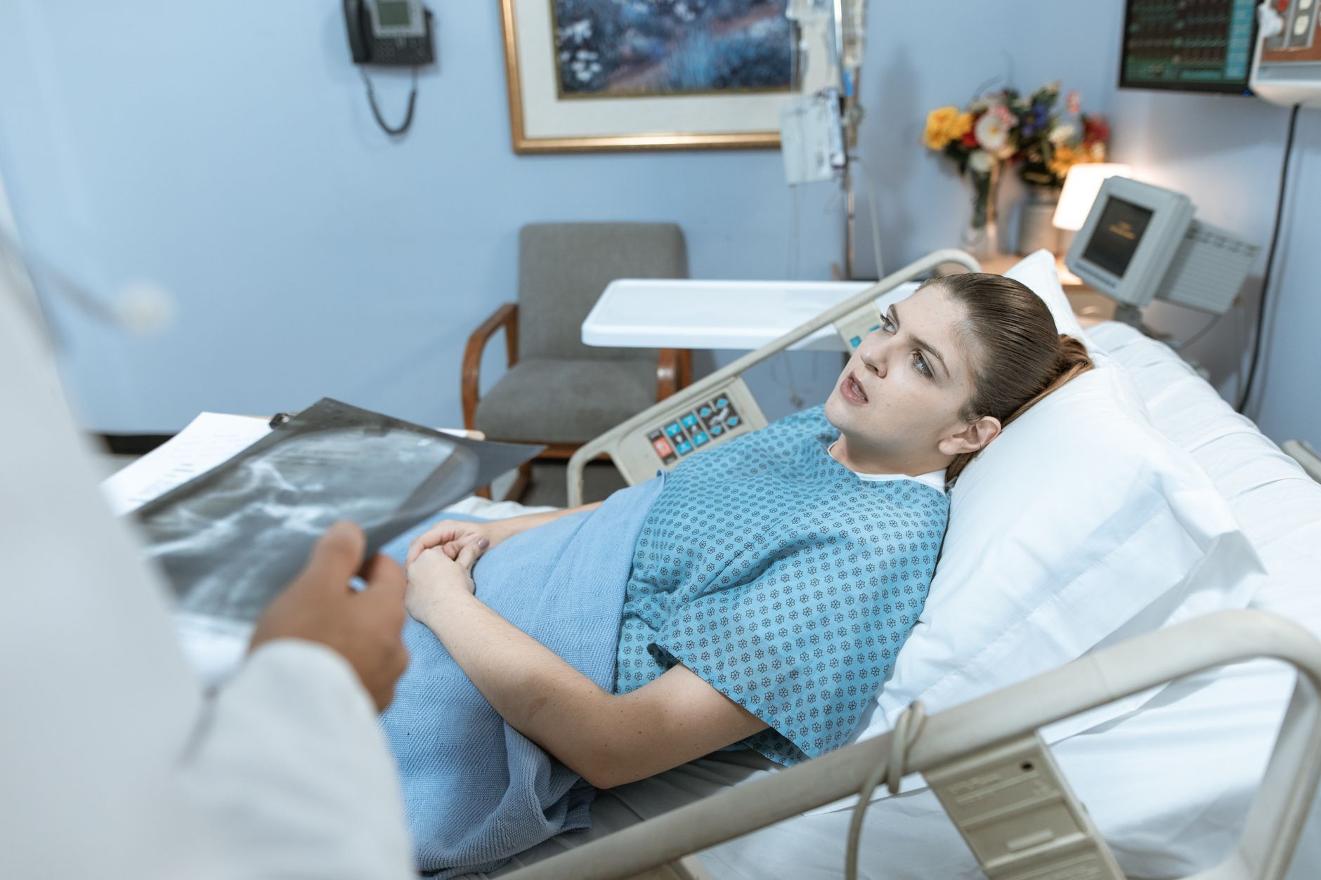 Caucasian woman in hospital bed receiving care from healthcare professional. — Reserve Overview: 10% Happier - How Meditation